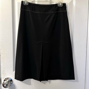 Ann Taylor Loft midi skirt in black color. A line shape.
